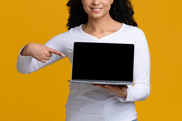 istock Cool Website. Unrecognizable Lady Pointing At Laptop Computer With Black Blank Screen 1313795292