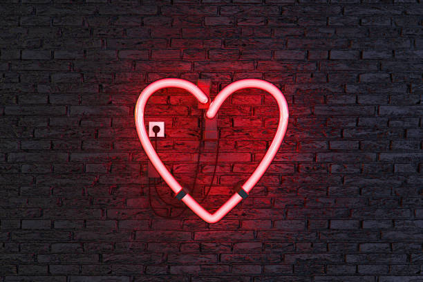 istock heart symbol on red neon lamp 1313795838