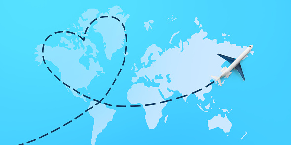 Airplane going heart shaped direction over sky looks like world map, panorama with copy space. web-banner for travelling, international tourism, business trip concept, creative image