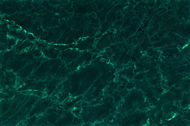 Dark green marble texture background with high resolution, top view of natural tiles stone in luxury and seamless glitter pattern. Dark green marble texture background with high resolution, top view of natural tiles stone in luxury and seamless glitter pattern. emerald green photos stock pictures, royalty-free photos & images