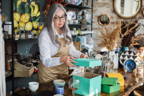 istock Aged woman doing inventory at decor store 1313800029