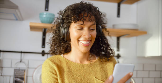 istock Mature woman having a video call in kitchen 1313800127