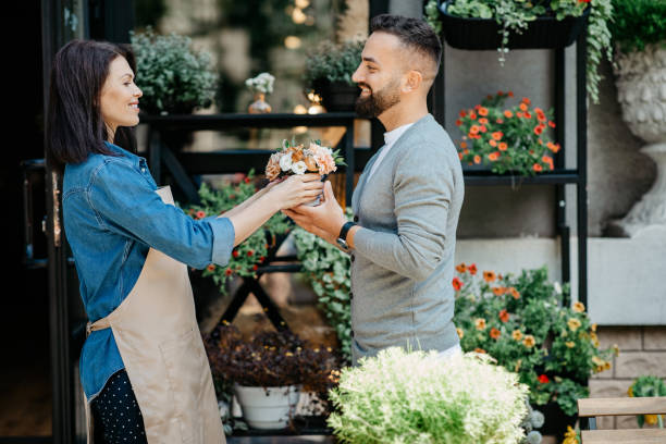 istock Outdoors shopping, pick up order from flower studio and creative work in store 1313800142
