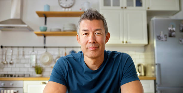 istock Mature man having a video call in kitchen 1313800673