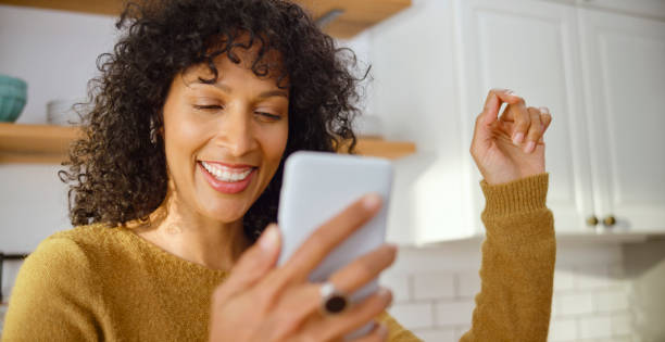istock Mature woman dancing in kitchen while listening music 1313800686