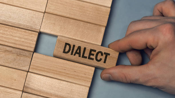 istock DIALECT word concept. Close-up wooden piece blocks on the table 1313800817