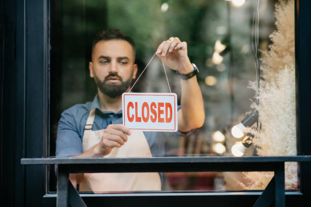 istock Store close during covid-19 outbreak and end of working day, problems in small business during quarantine 1313800938