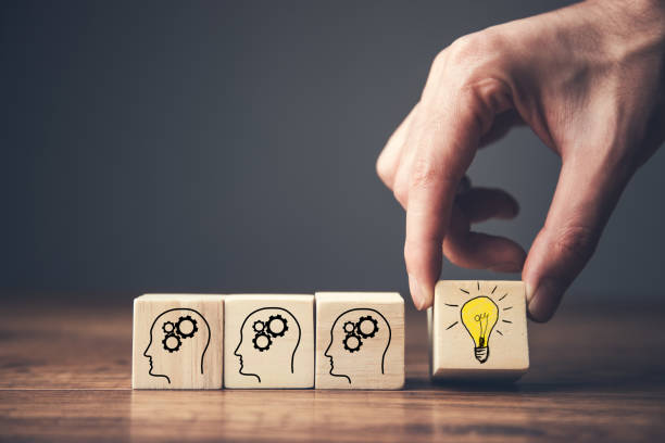 istock cubes with head symbols and light bulb 1313801052