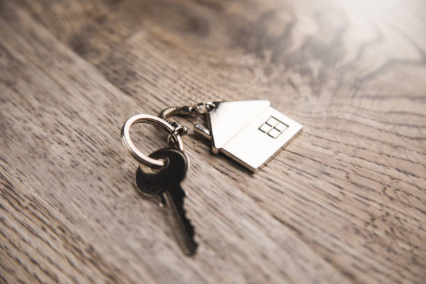 istock house model and house key 1313801098