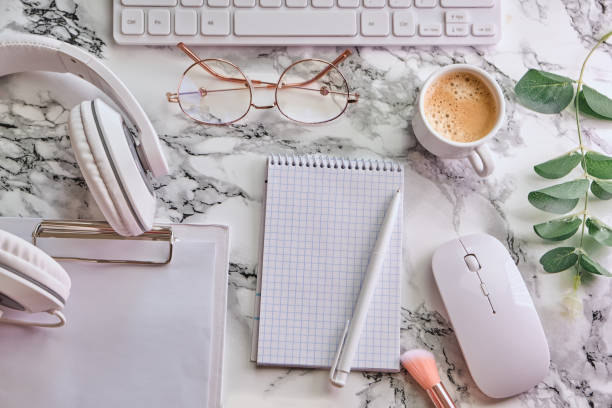 istock Workplace mockup with notebook, glasses, headphones and make up accessories 1313801768