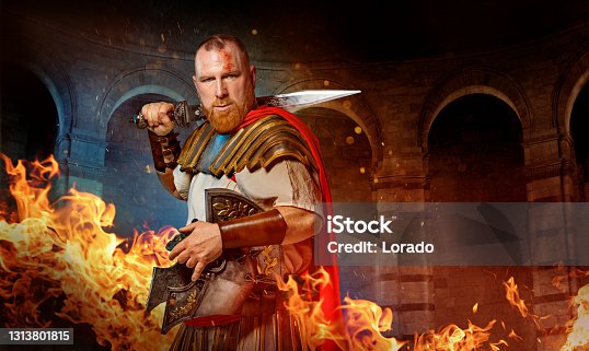 istock A redhead Warrior Gladiator in a fire filled fighting arena 1313801815