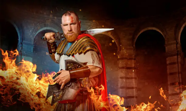 A modern, superhero, comic book re-interpretation of a redhead Warrior Gladiator in a fire filled fighting arena