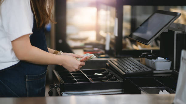 small business - coffee serving cafeteria worker checkout counter imagens e fotografias de stock