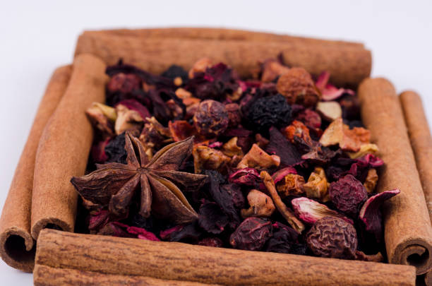 istock Tea leaves with cinnamon sticks on a light background. 1313802714