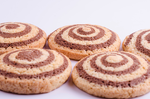 Cookies with the image of a spiral on a light background