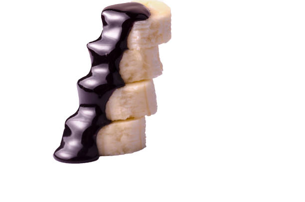 Appetizing banana slices in dark chocolate
