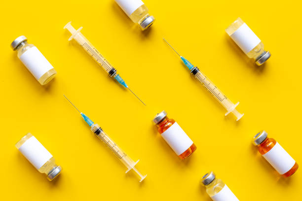 istock Vaccination concept. Vaccine vial dose with with syringe 1313803510