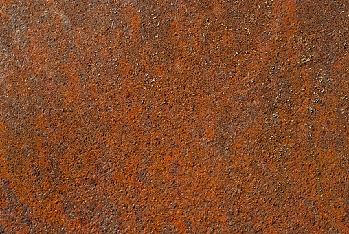 High resolution image of an obsolete weathered, corroded, rusty steel stripe screen panel surface detail, background grunge texture.