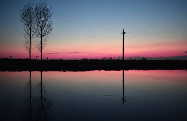 istock amazing sunset on the Muzza river 1313805138