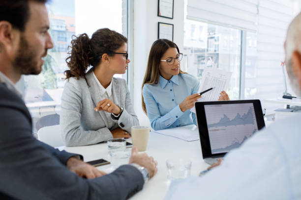 istock Business people having board meeting in modern office 1313805764