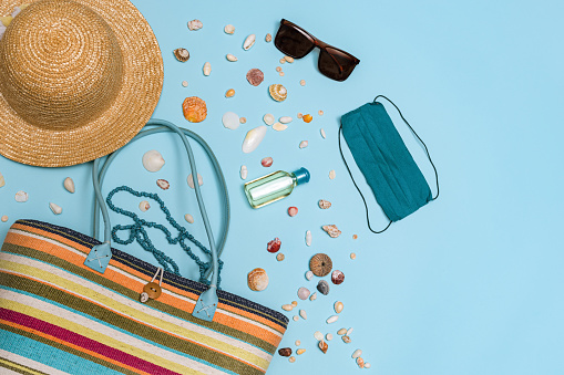 Top View of Summer Vacation Accessories on Blue Background