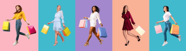 istock Young diverse ladies walking with bags at colorful studio backgrounds 1313806341