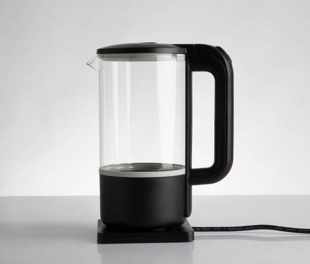 istock Empty electric glass kettle isolated on white 1313806454