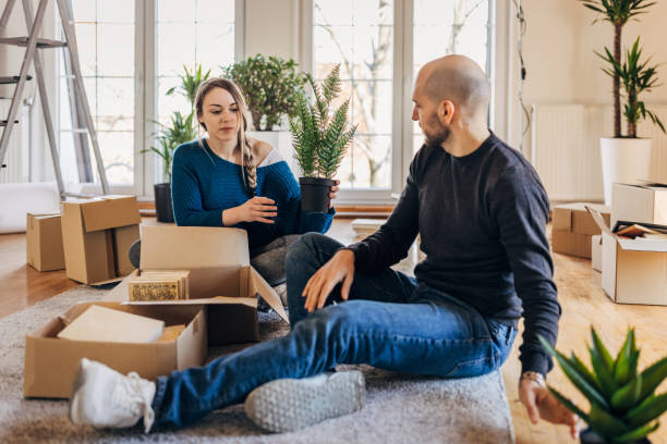 istock Young couple unpacking in their new apartment 1313807079