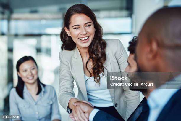 Shot Of A Young Businesswoman Shaking Hands With A Colleague During A Meeting In A Modern Office Stock Photo - Download Image Now