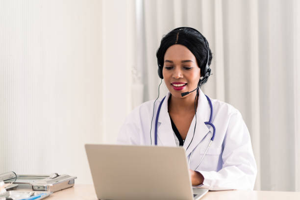 istock african woman doctor in headset taking calling on her headset microphone online for a ache patient 1313808073