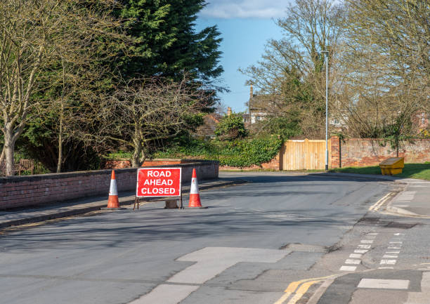 istock Road closed sign with cones 1313808835