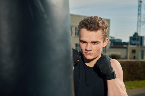 istock Young man boxing outdoors 1313809407