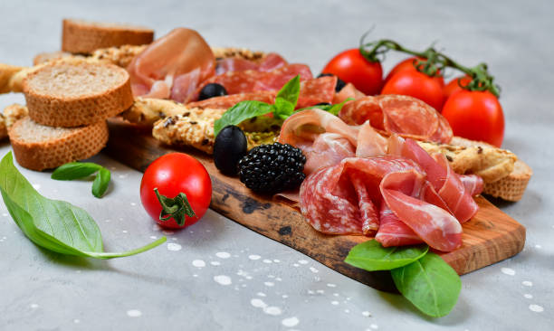 aperitif happy hour italian antipasti prosciutto, salami, bresaola olives - italian appetizer imagens e fotografias de stock