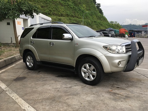 Private Toyota Fortuner Suv Car on road in Semarang, Indonesia