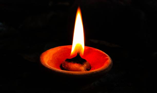 istock Oil lamp or Diya with black background 1313812647