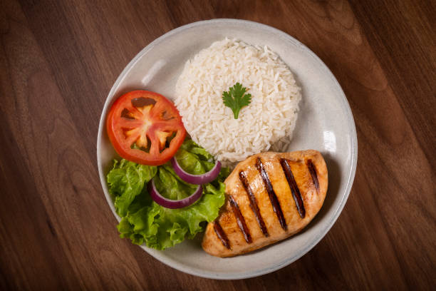 istock Grilled chicken with salad and rice. 1313813408