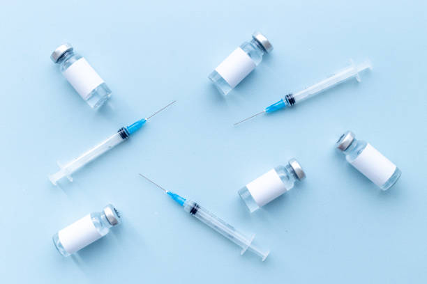 istock Vaccination concept. Vaccine vial dose with with syringe 1313813601