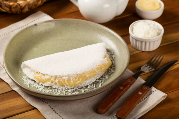 istock Sweet tapioca stuffed with coconut cream. Brazilian tapioca. 1313813951