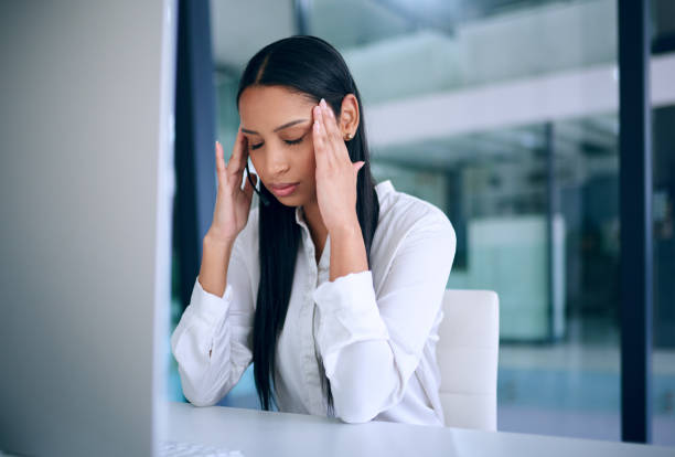 istock Shot of a young businesswoman looking stressed out while using a computer in a modern office 1313814233