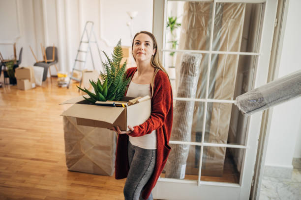 istock Woman moving in her new home 1313815047