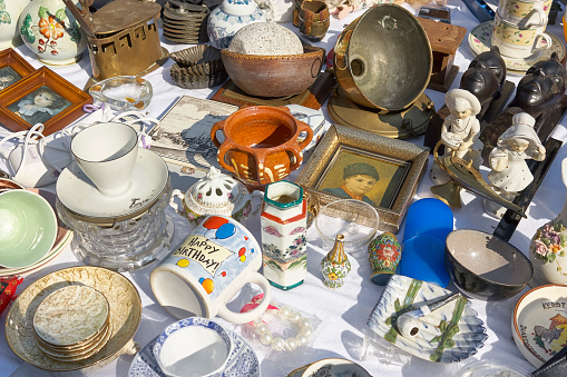 Franeker, The Netherlands - April 30 2011: Top view and closeup on various old, vintage and kitsch objects on the flea market during King's Day in the Netherlands.