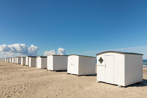 Wooden white beach huts at the beach of Blokhus, North  Jutland, Denmark