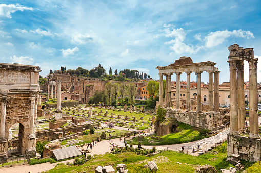 forum romanum in Rome, Italy. Temple of Saturn and Temple of Castor and Pollux, ancient ruins of the Roman Forum. Travel and vacation in Italy.