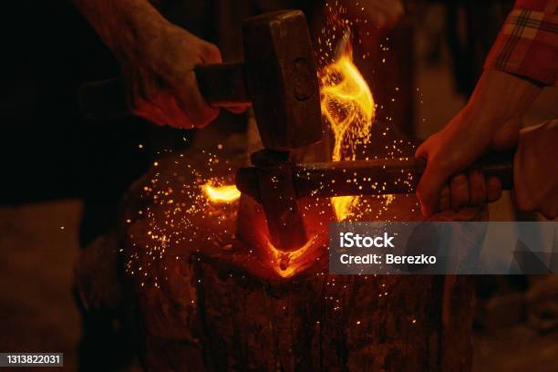 Blacksmiths Hit Molten Metal With Hammers Close Up Stock Photo - Download Image Now - Blacksmith, Blacksmith Shop, Forgery