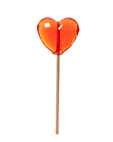 Colorful transparent heart shaped lollipop isolated on white background.