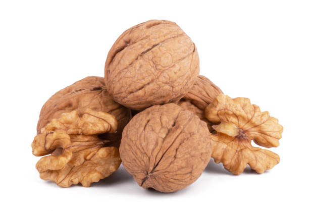 istock wallnut and a cracked walnut isolated on the white background 1313823764