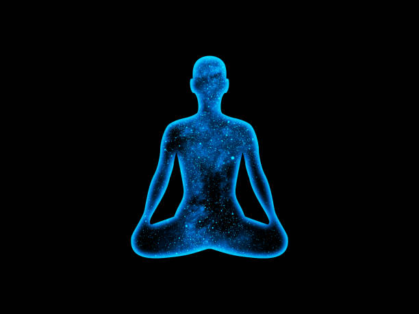 istock Cosmic radiant man in the lotus pose on a black background 1313823767
