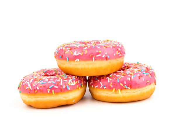istock Fresh made Donuts isolated on white background. Doughnuts are traditional sweet pastries. Copy space for text. 1313824989