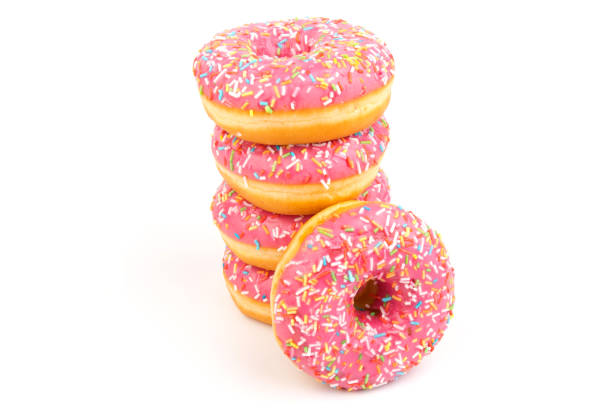 istock Fresh made Donuts isolated on white background. Doughnuts are traditional sweet pastries. Copy space for text. 1313825019