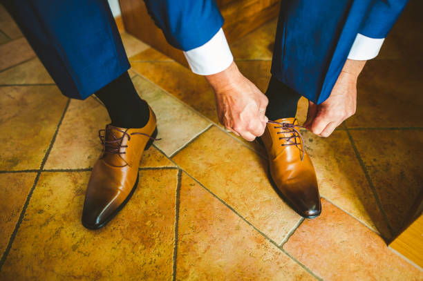 istock Business man knot shoe lace indoor 1313825039